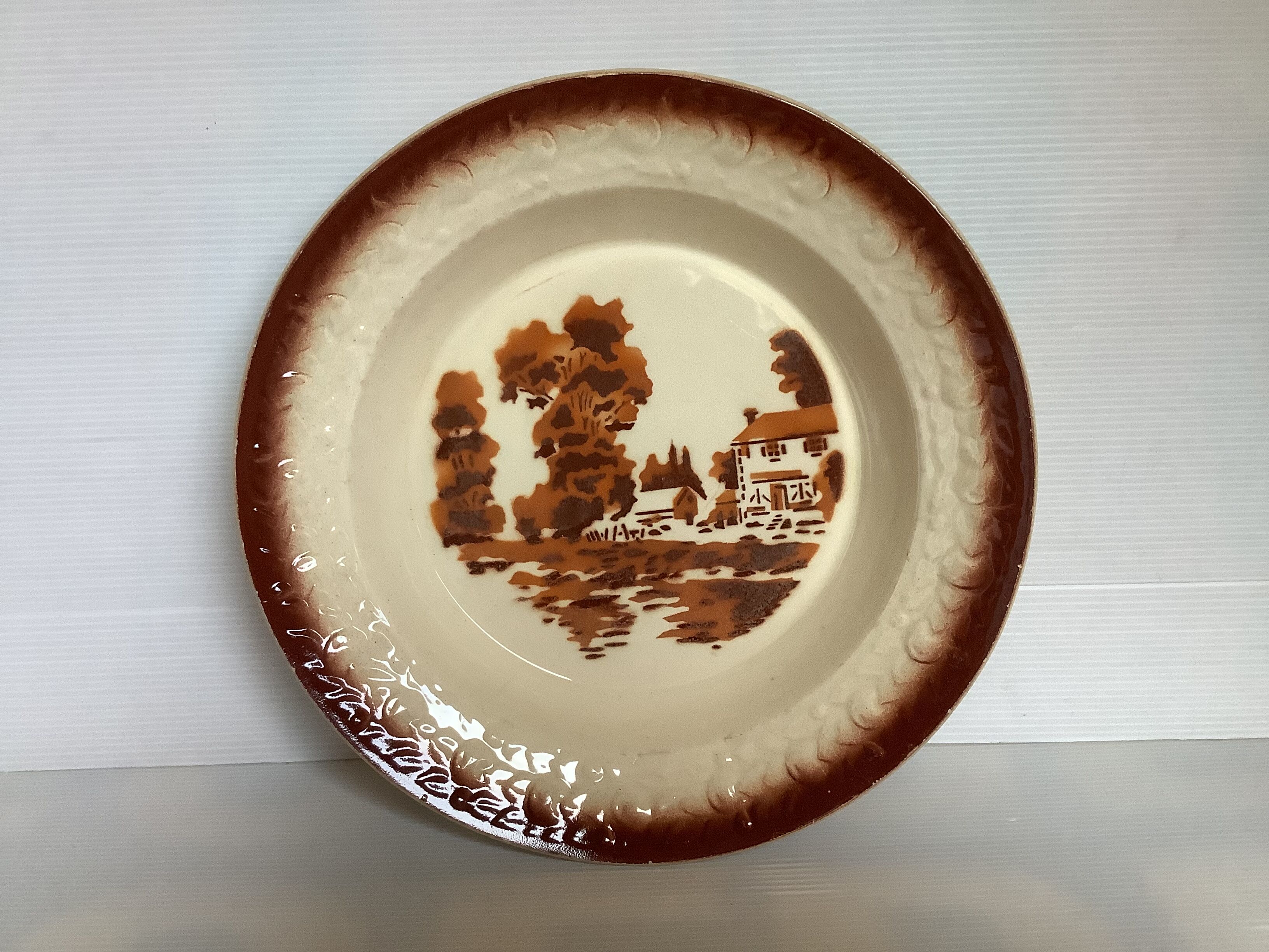 Earthenware plate from Moulin des Loups with stencil pattern.