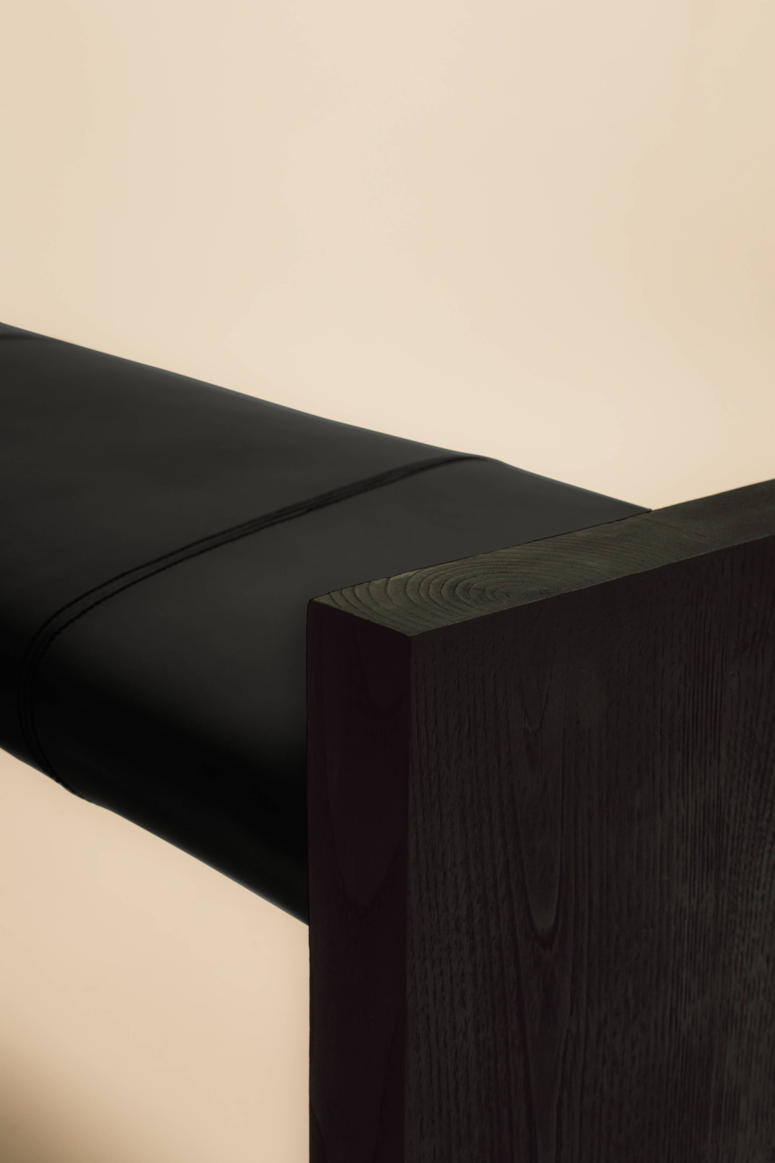 Maërl SEPIA bench, ebonized chestnut and black leather.