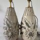 Pair of white glazed stoneware lamp bases, 20th-century floral decoration.