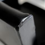 Pair of stainless steel, black leather-like armchairs, France, circa 1970