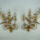 Pair of large floral wall lamps in gilded and lacquered metal. Italy 1960s