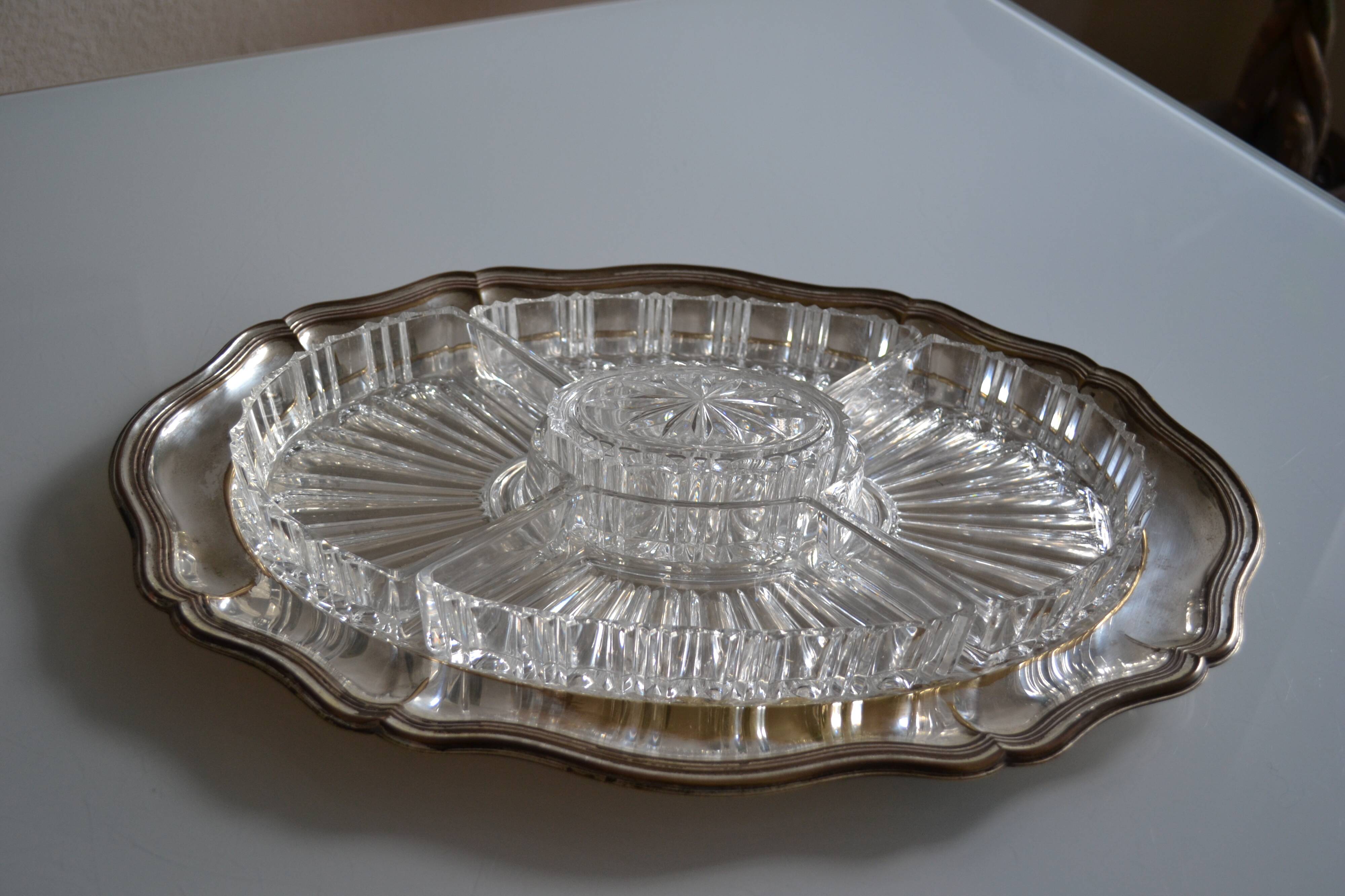 Silver-plated metal aperitif serving tray with HKE hallmark and glass.