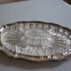 Silver-plated metal aperitif serving tray with HKE hallmark and glass.