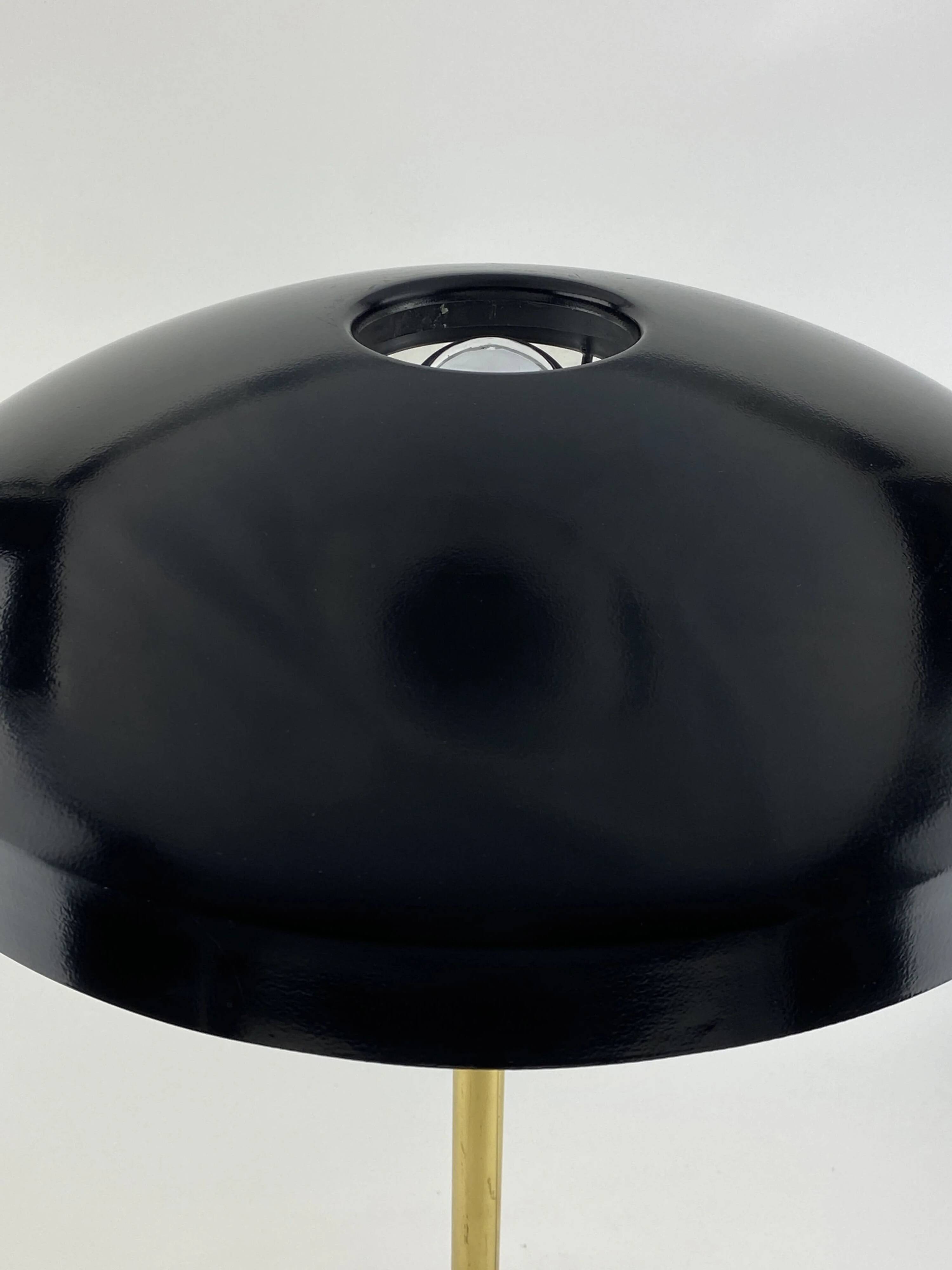 Rare black and gold UFO table lamp by Louis Kalff for Philips.