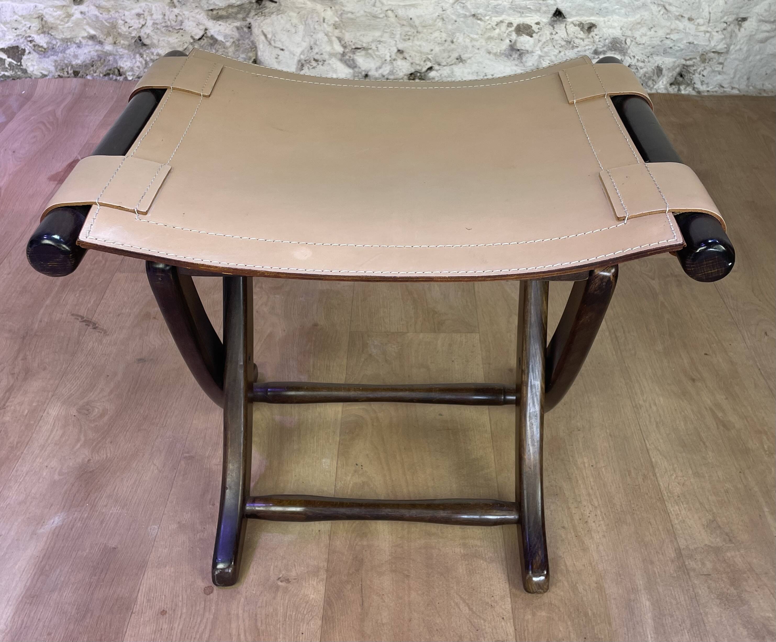 Colonial style leather armchair and ottoman