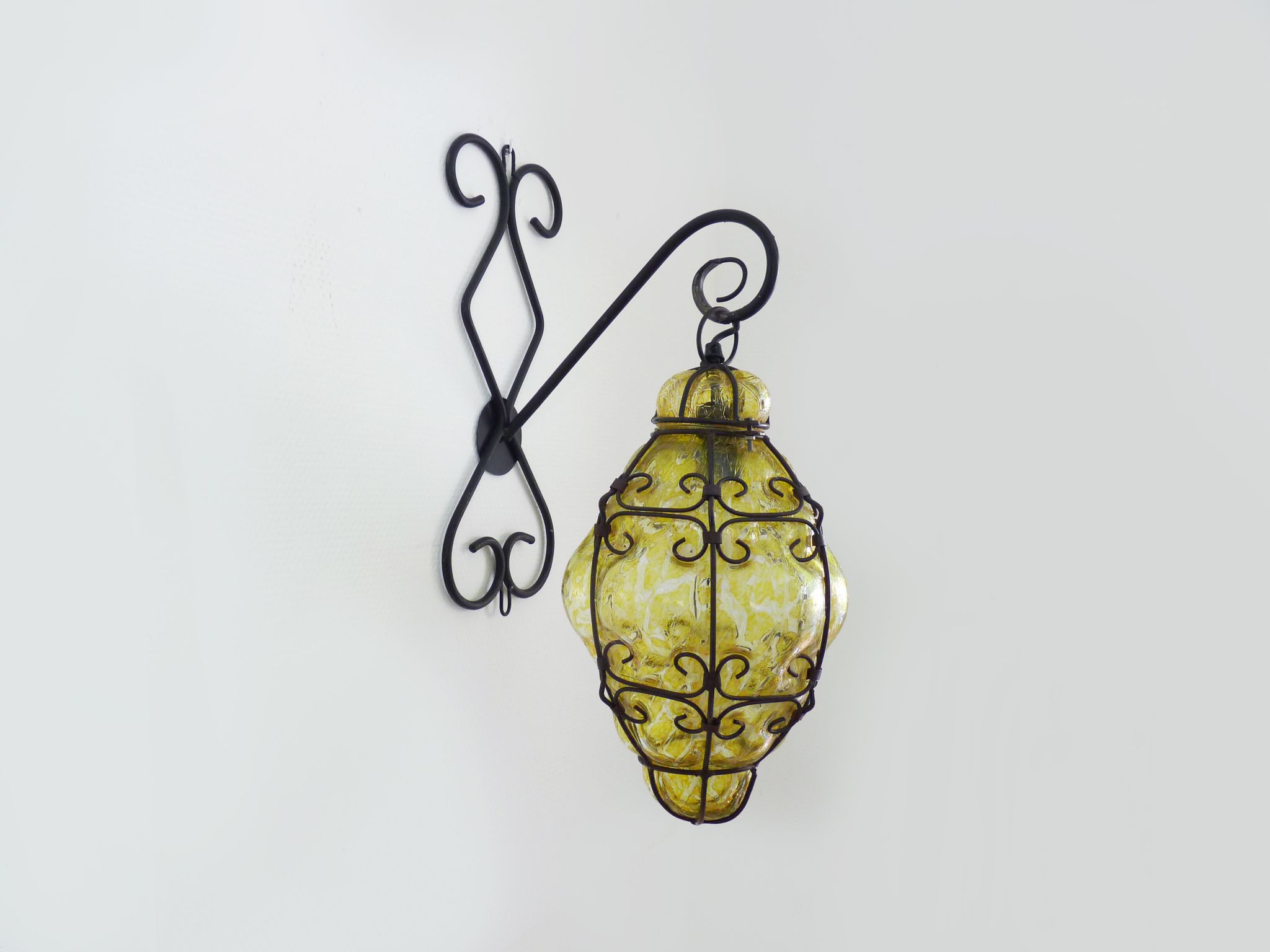 Italian vintage wall lamp in yellow blown glass and wrought iron. Year 70 80