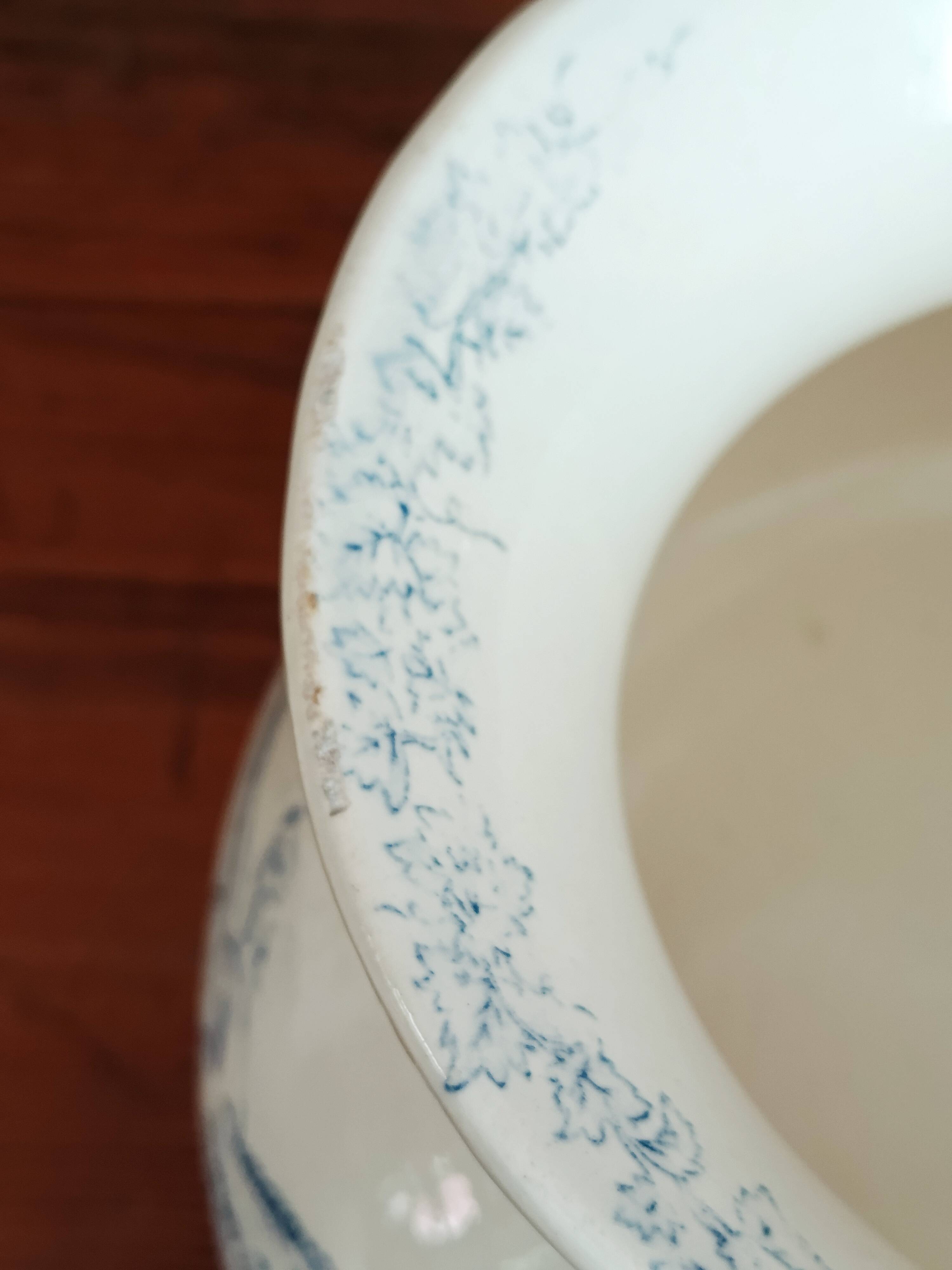 Old bulbous jug in ironstone earthenware