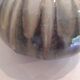 Globe vase, narrow neck, wide body.
