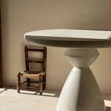 Travertine-effect stone dining table