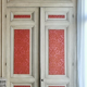 Closet front with double molded doors in patinated wood XX century