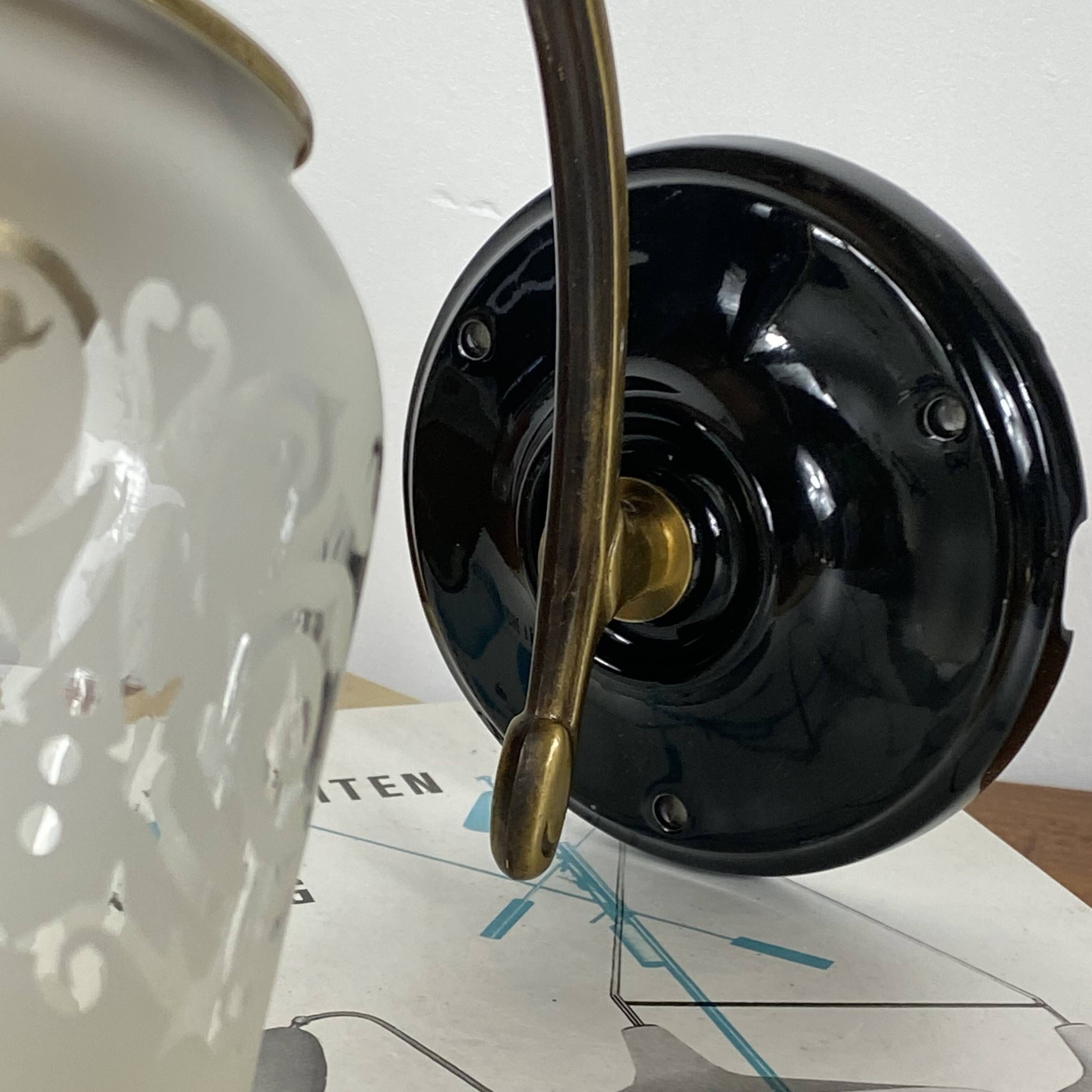 Pair of brass swan neck wall sconces, glass tulips with screen printing.