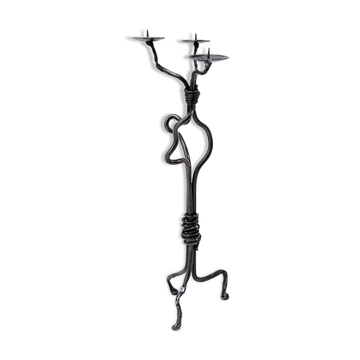 Large wrought iron candelabrum with an abstract design and three candle holders.