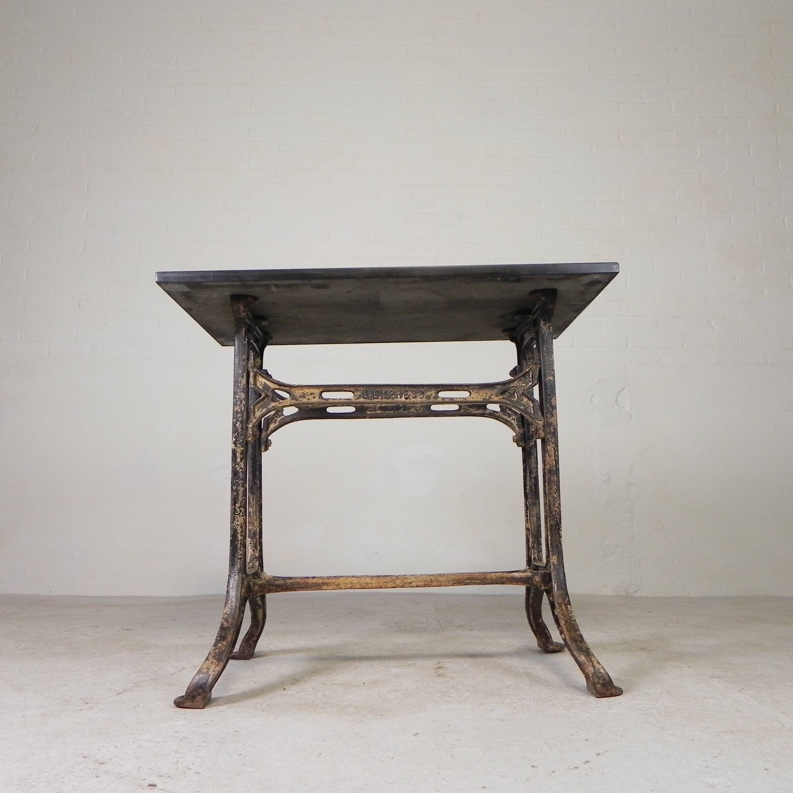 Industrial table, garden table with hard stone slab on cast iron frame, 1930s