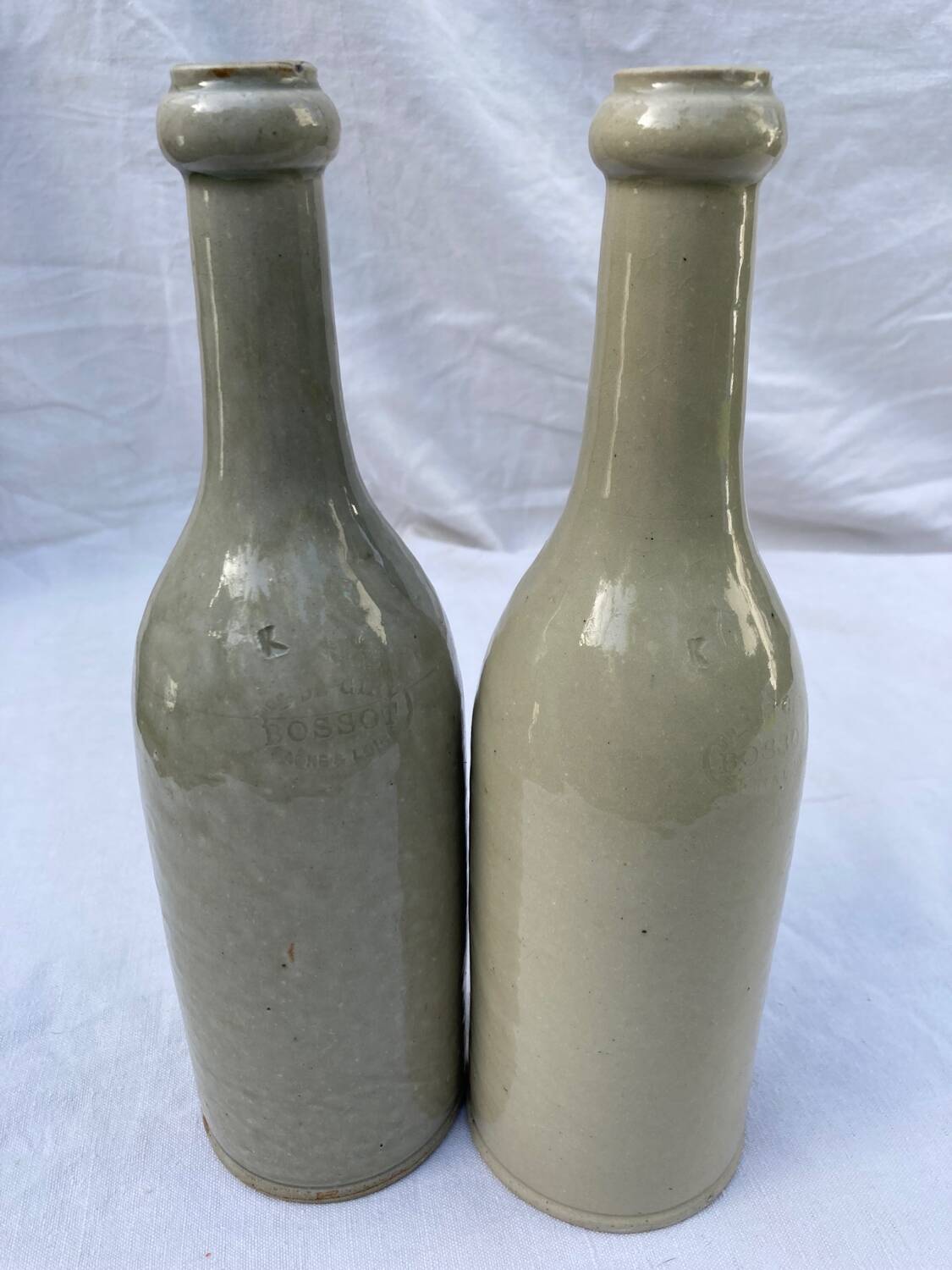 Pair of old Bossot stoneware bottles
