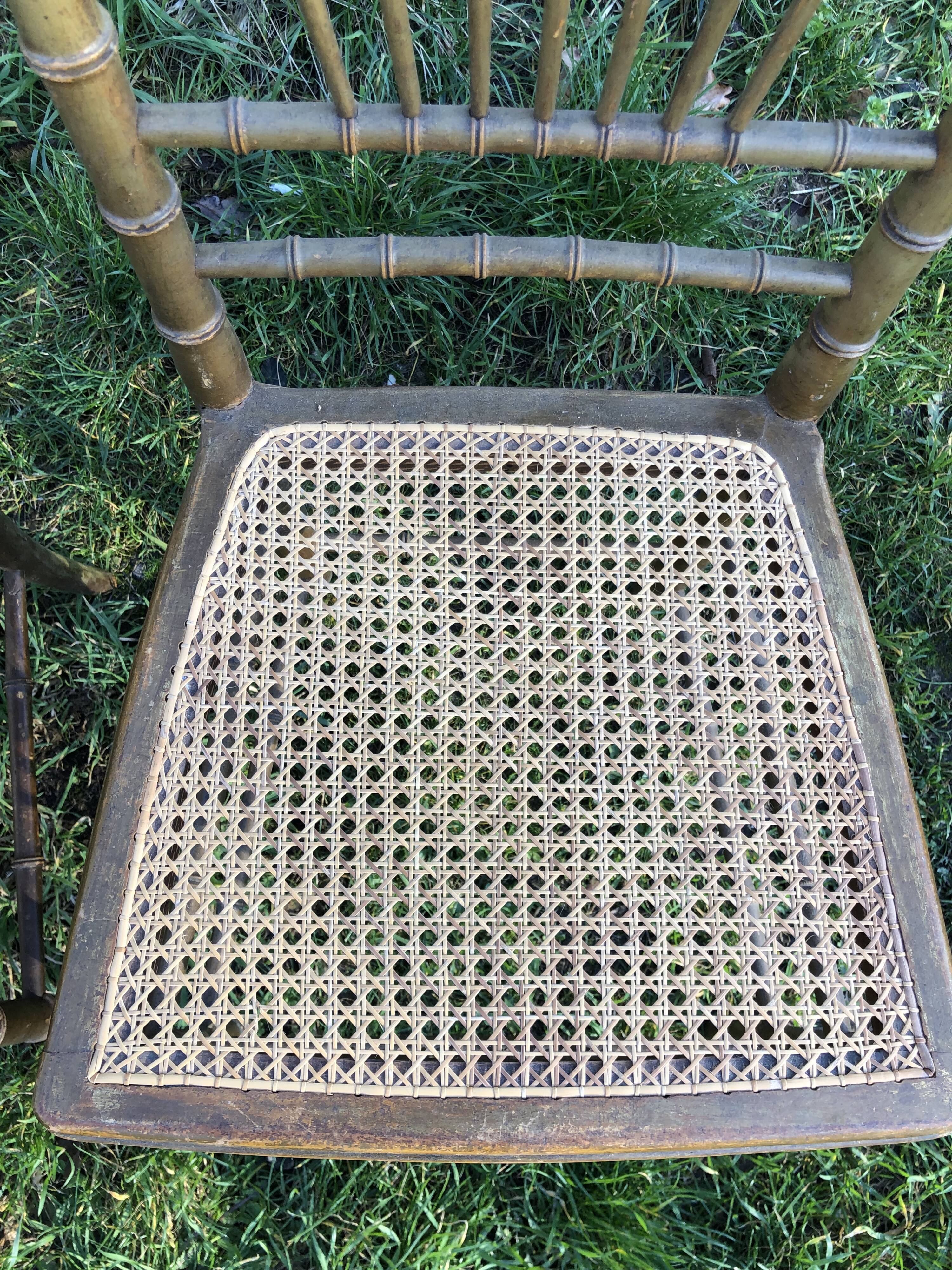 Pair of caned chairs in gilded wood