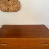 Vintage 1960s chest of drawers with covered handles.