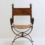 Curule armchair in wrought iron and leather