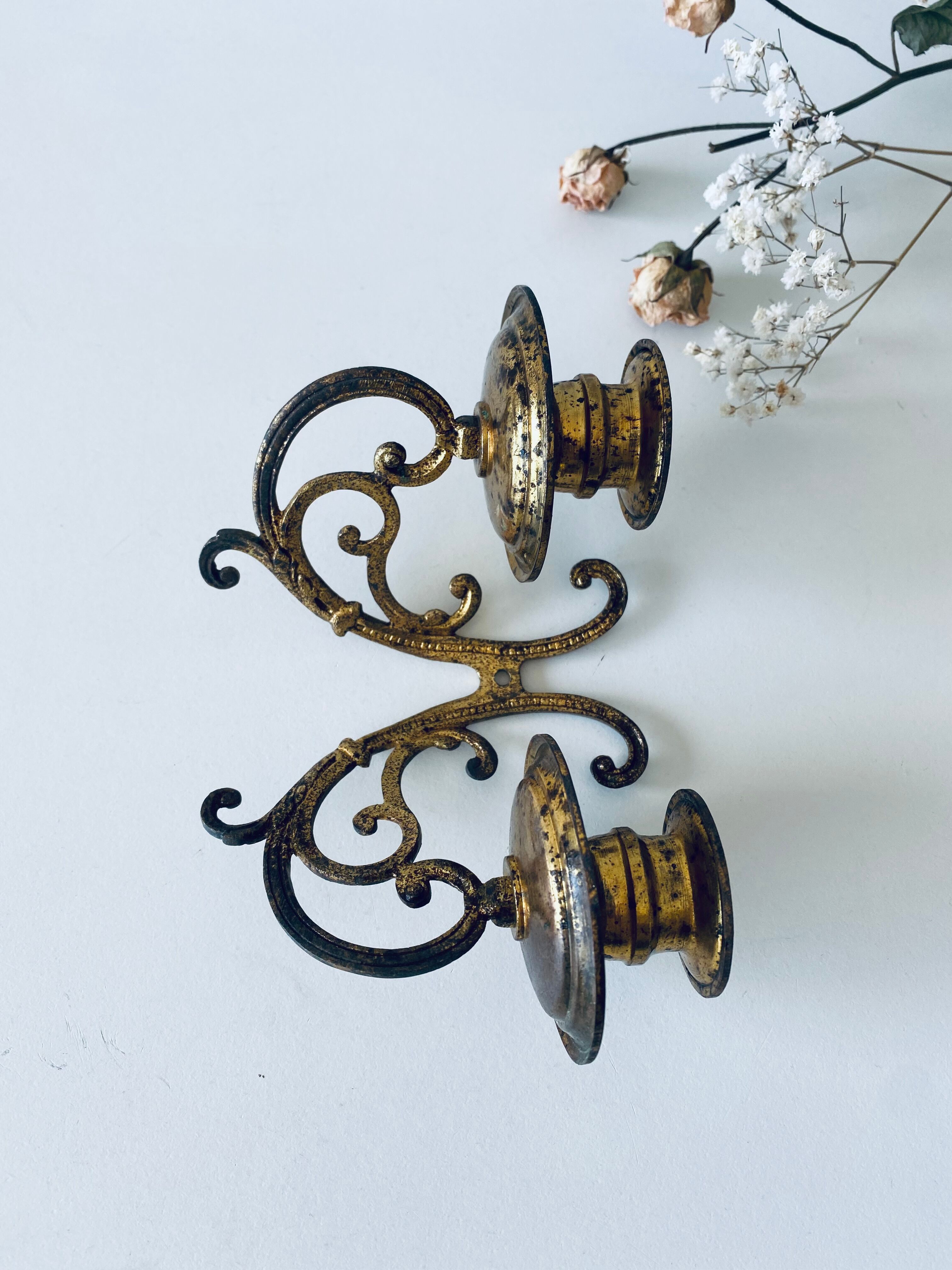 Old wall candle holder in golden brass