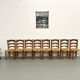 Set of 8 chairs in solid elm with straw seats.