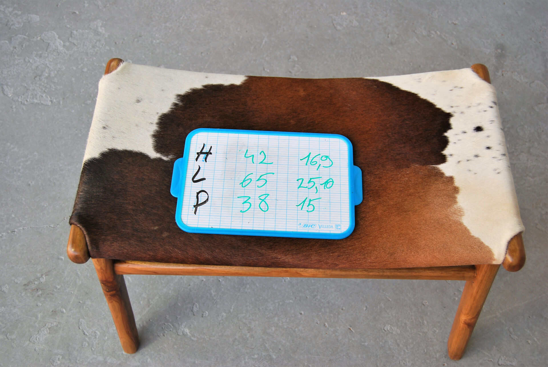 Chair in cowhide with ottoman inspiration Norwegian