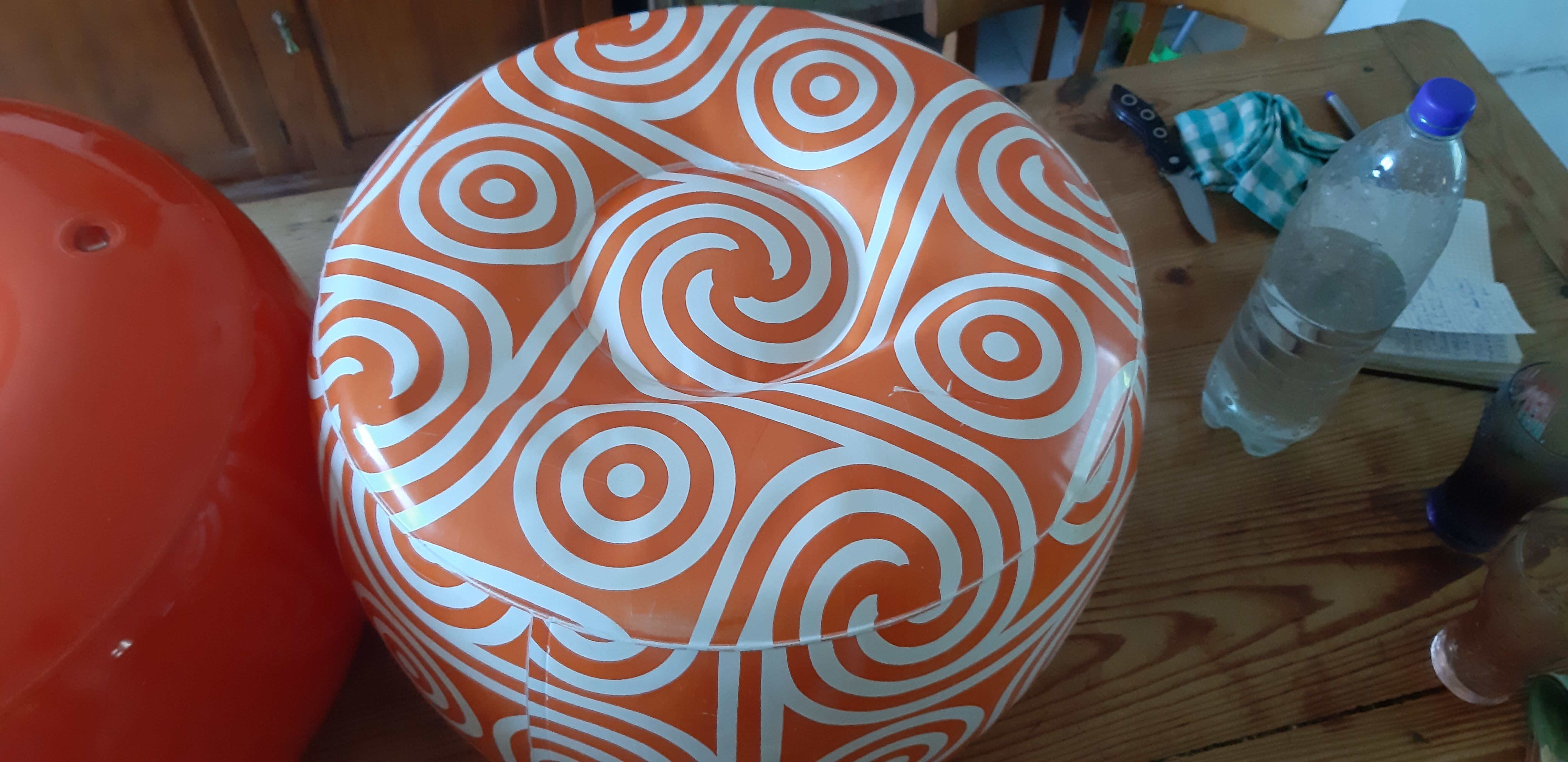 2 vintage inflatable poufs in orange plastic