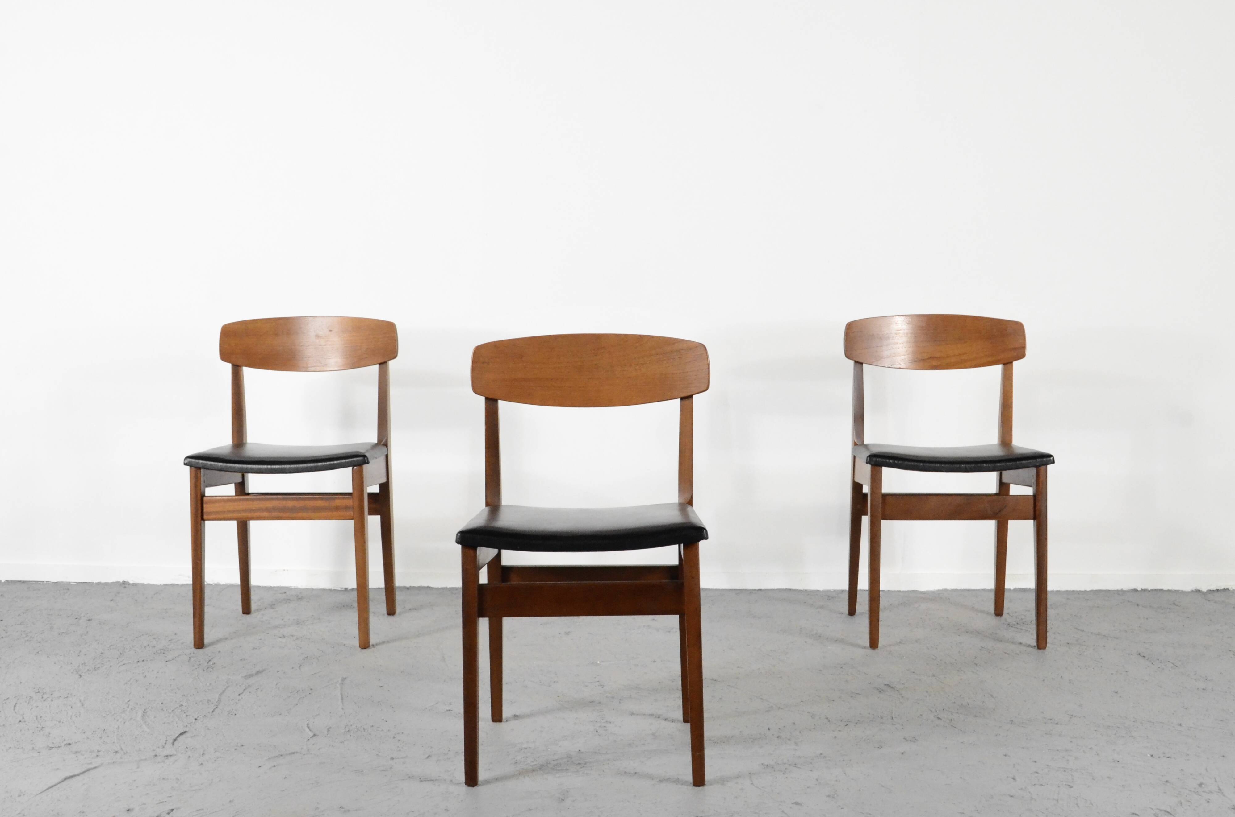 Set Of 4 Midcentury Teak And Leatherette Chairs.