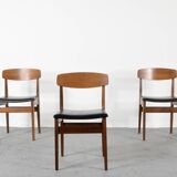 Ensemble de 4 chaises en teck et similicuir du milieu du siècle.