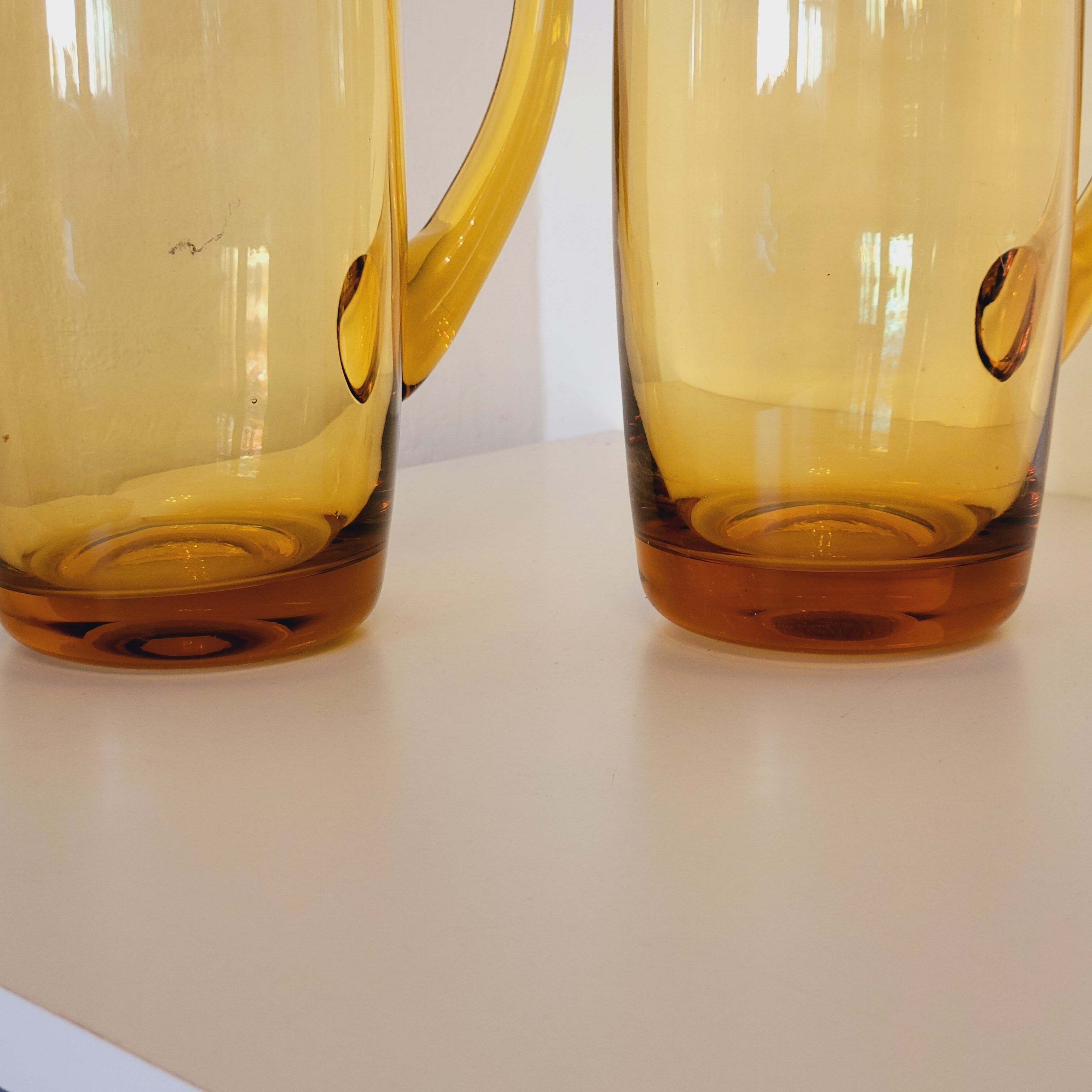 2 carafes in vintage amber yellow blown glass