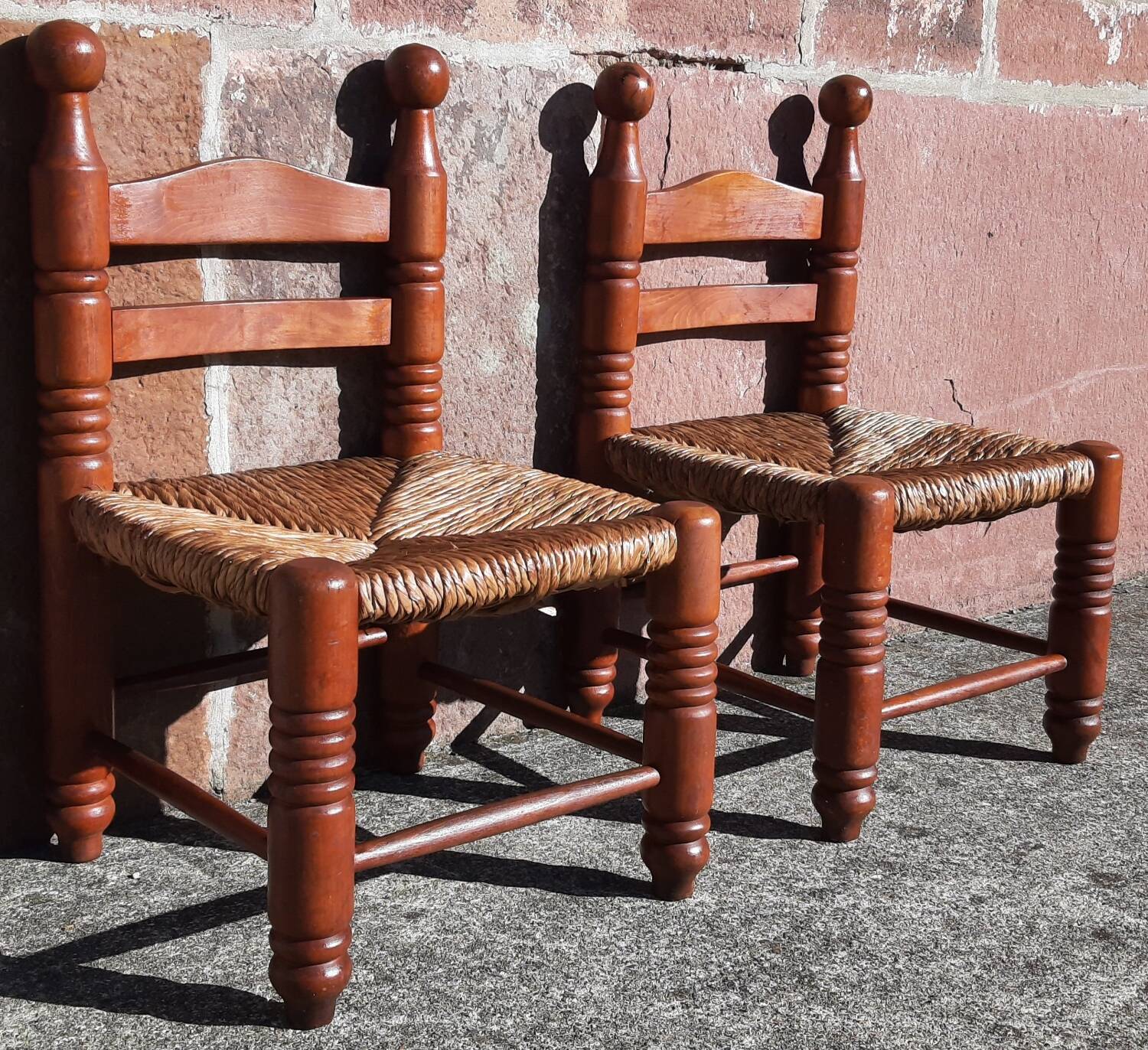 Pair of low armchairs by the fireplace. (Straw seat)