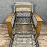 tulip armchair convertible into a bed, Art Deco period, light wood