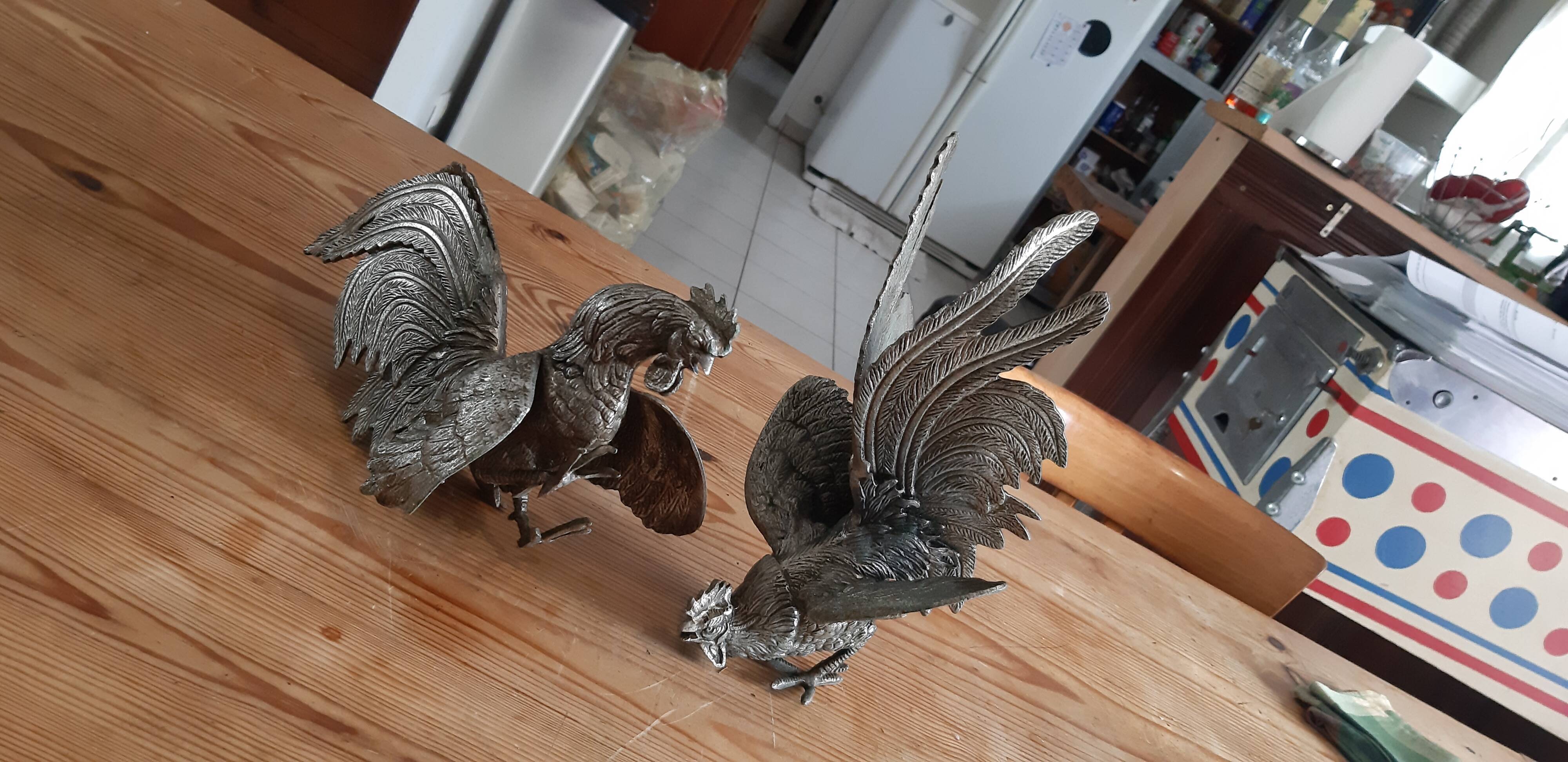 2 silver metal roosters
