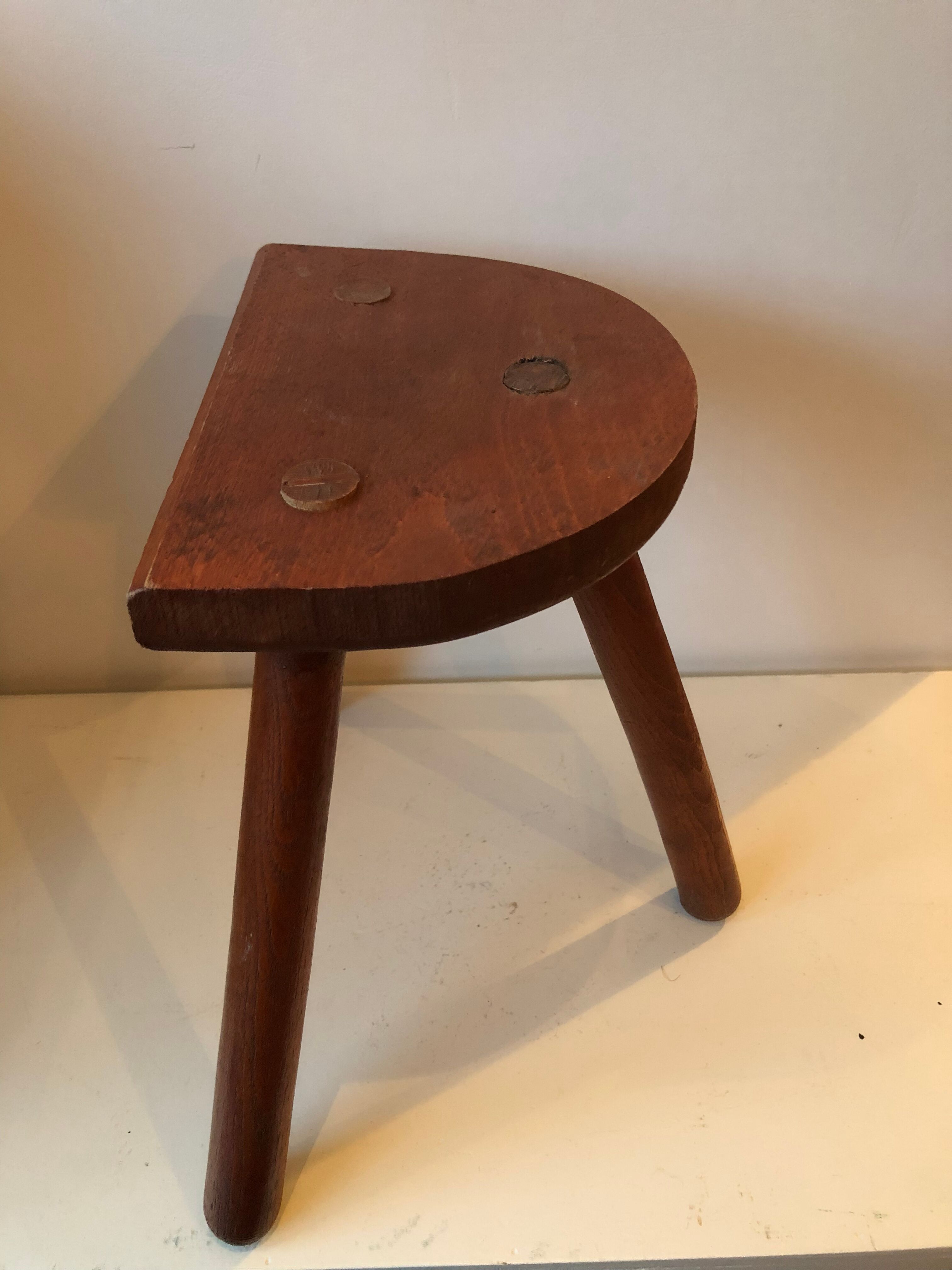 Old wooden tripod stool