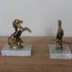 Pair of vintage bookends with rearing horses in gilded metal on marble bases.