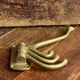 Adjustable nautical coat hook in solid brass