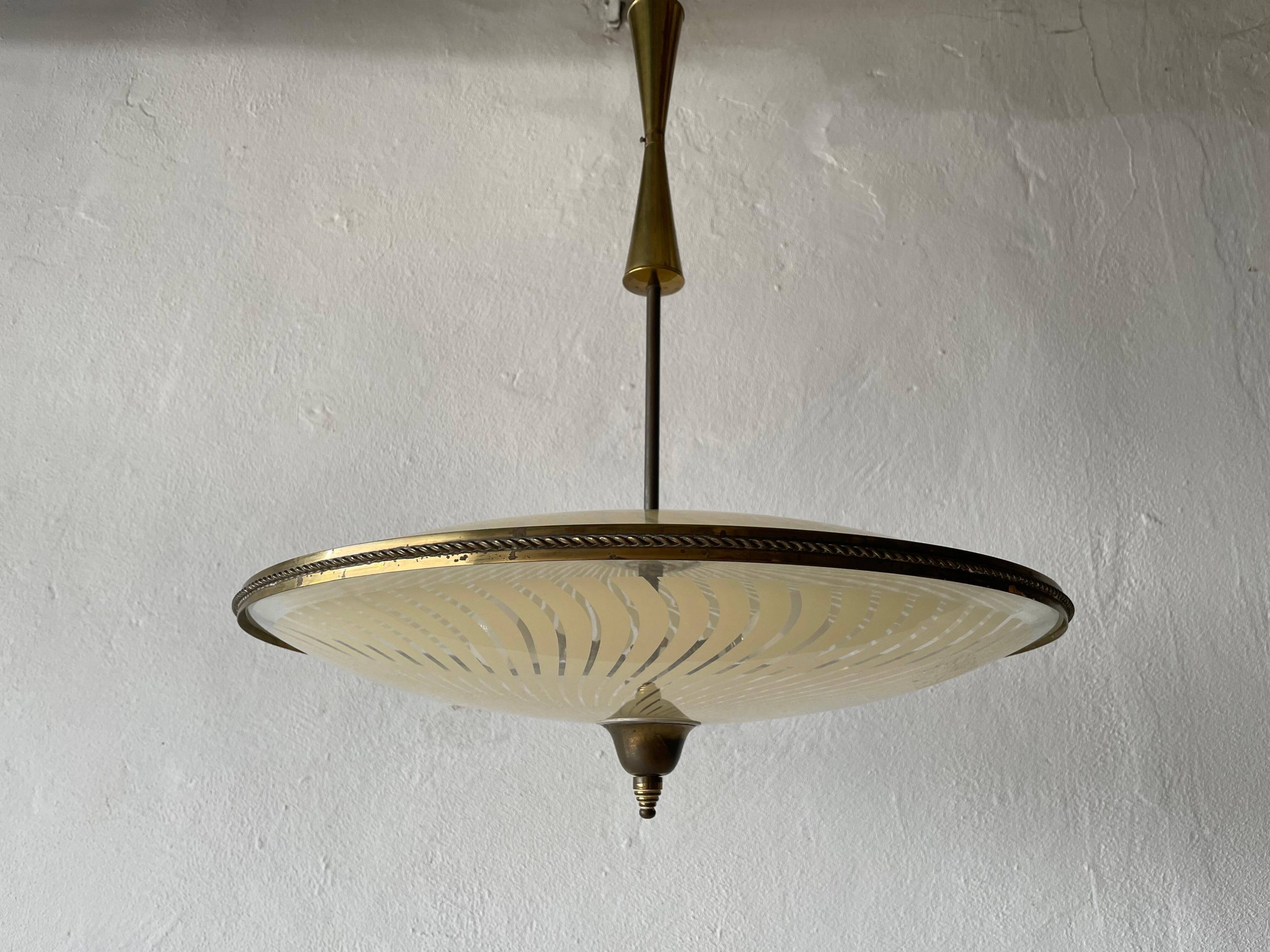 Large UFO design ceiling light in brass and printed glass, 1950s, Italy.