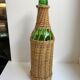 bouteille entourée de rotin années 70