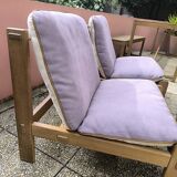 Pair of solid wood and leather lounge chairs, European work, circa 1970.