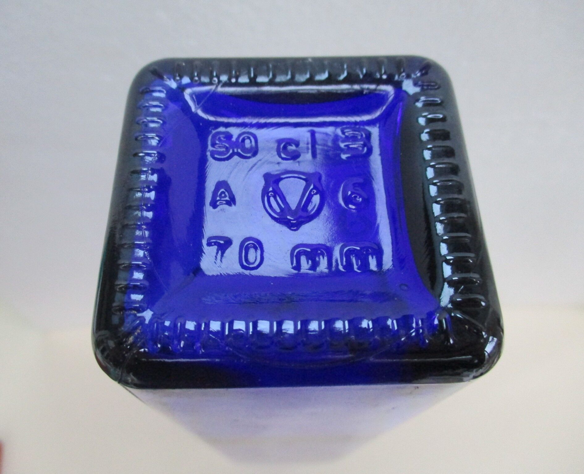 Blue glass bottle, square