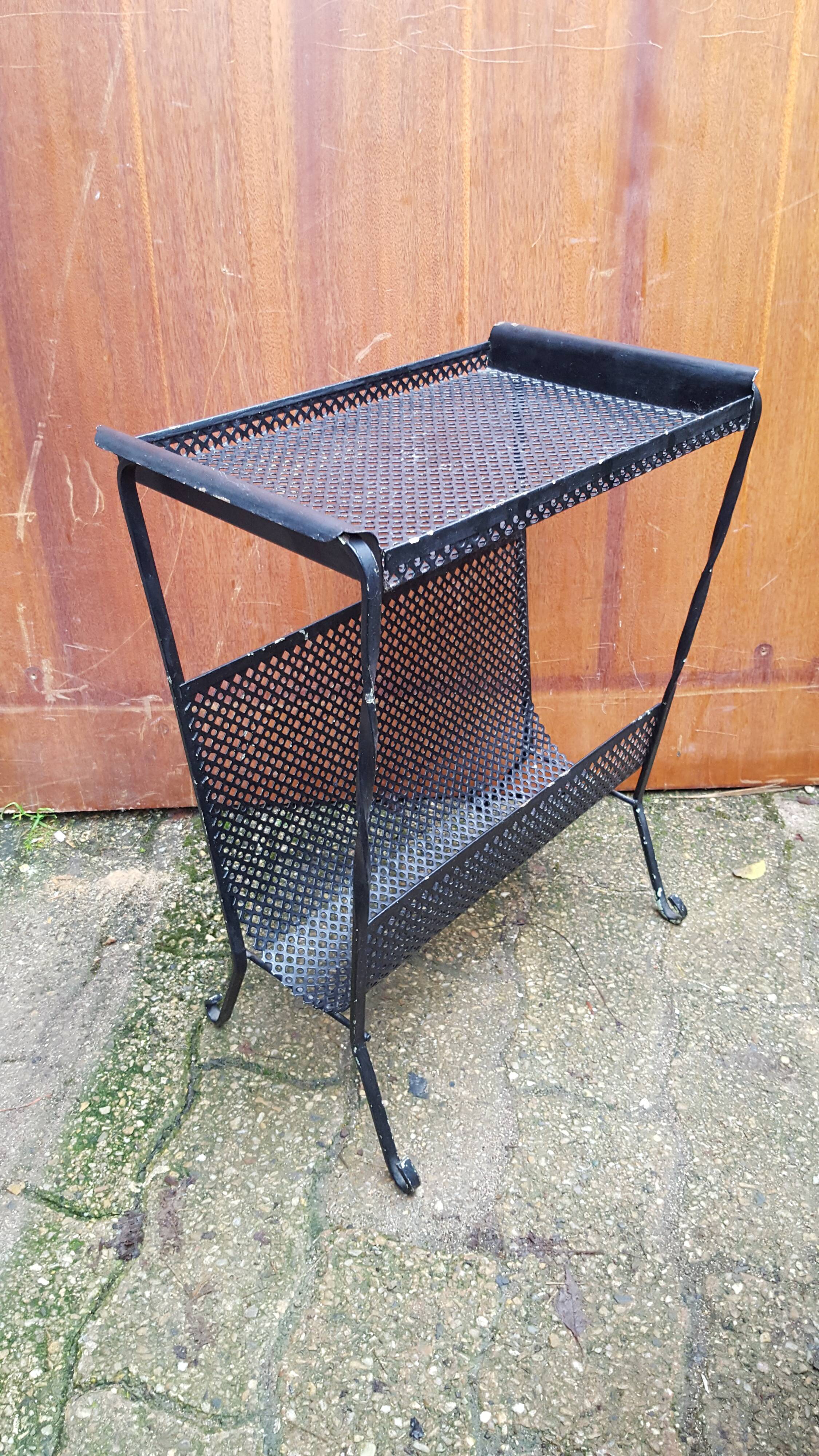 Perforated metal magazine holder design 50