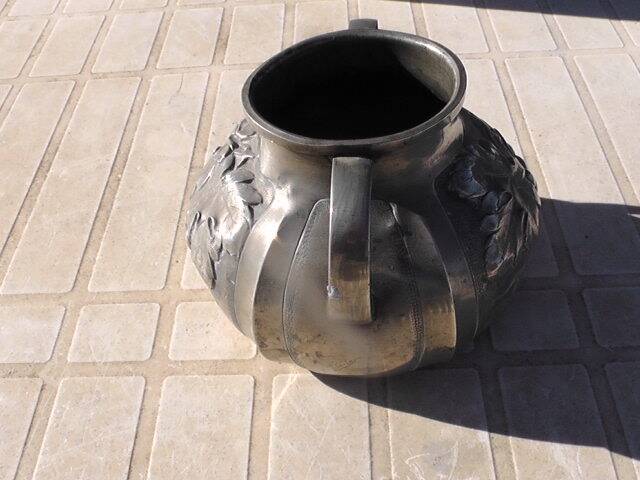 Pewter vase with vine decoration, 1930