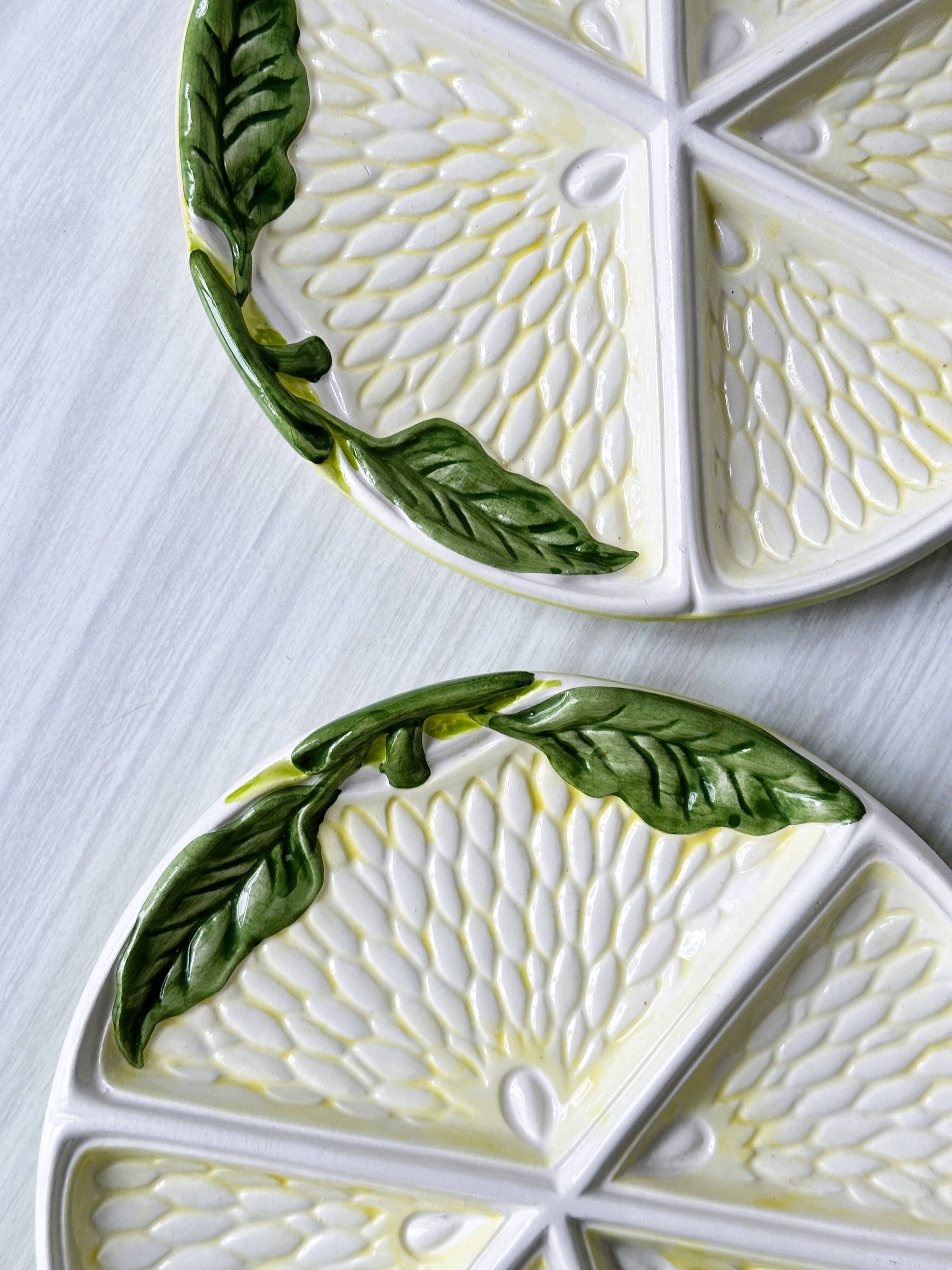 2 ceramic plates depicting a lemon