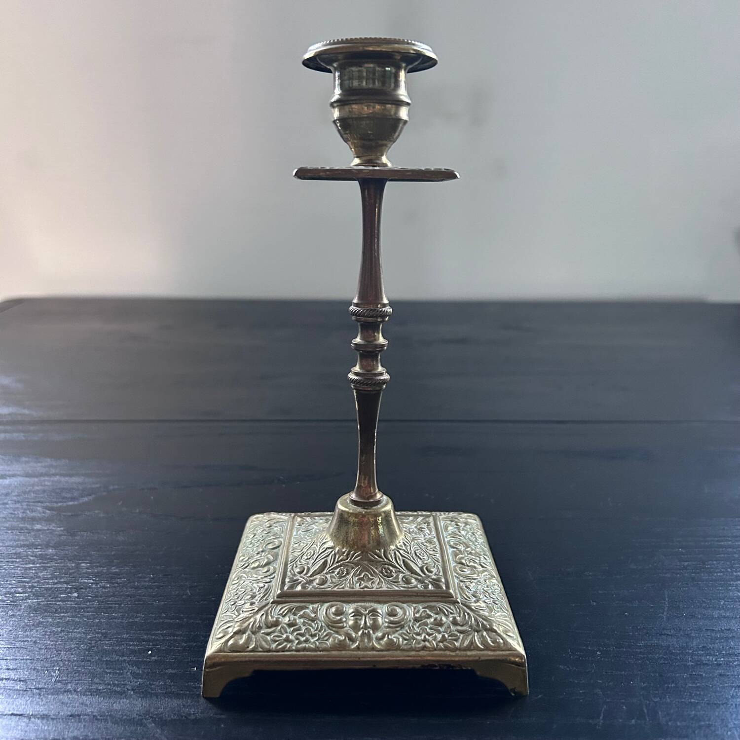 Chiseled brass candle holder
