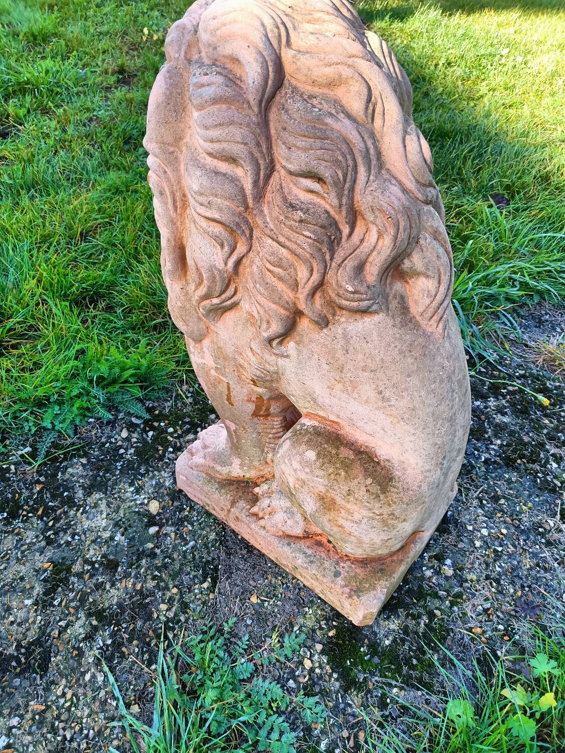 Pair of old terracotta garden lions