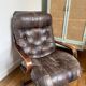 1970s Scandinavian armchair in curved laminated wood with a leather seat.