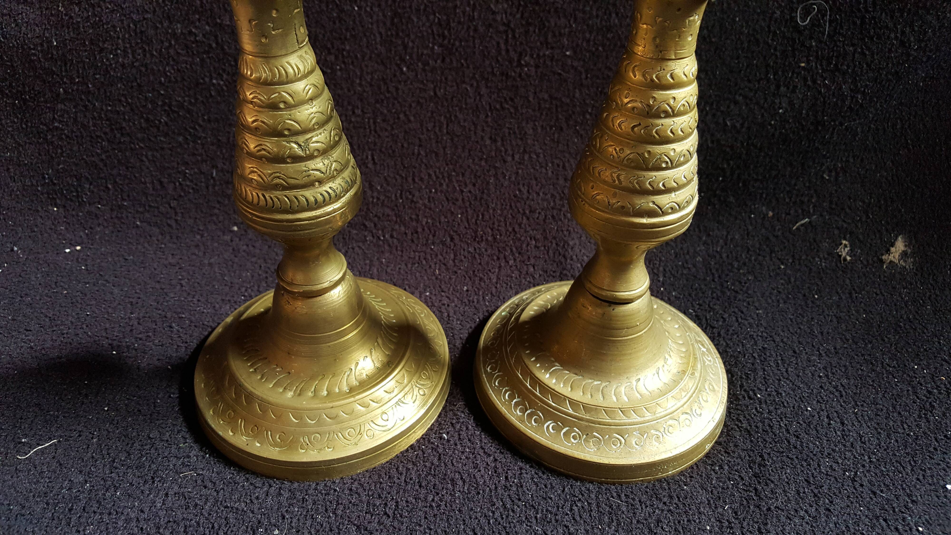 Former pair of bronze candlesticks