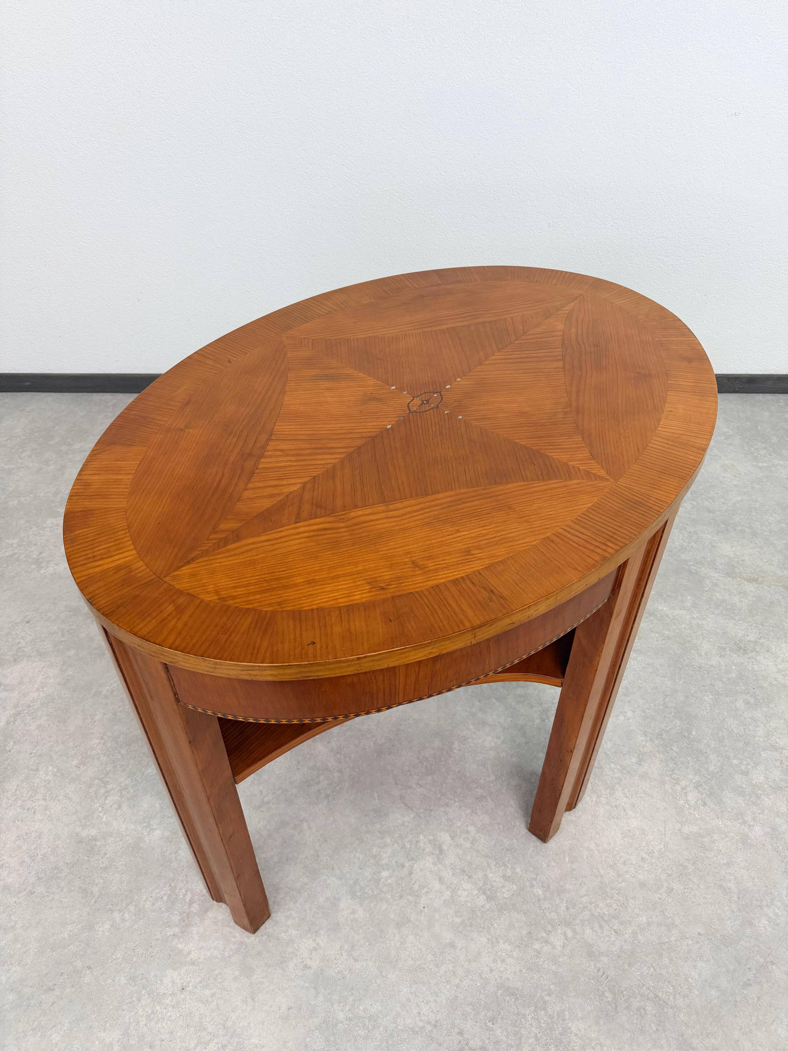 Oval side table in the style of Kolo Moser