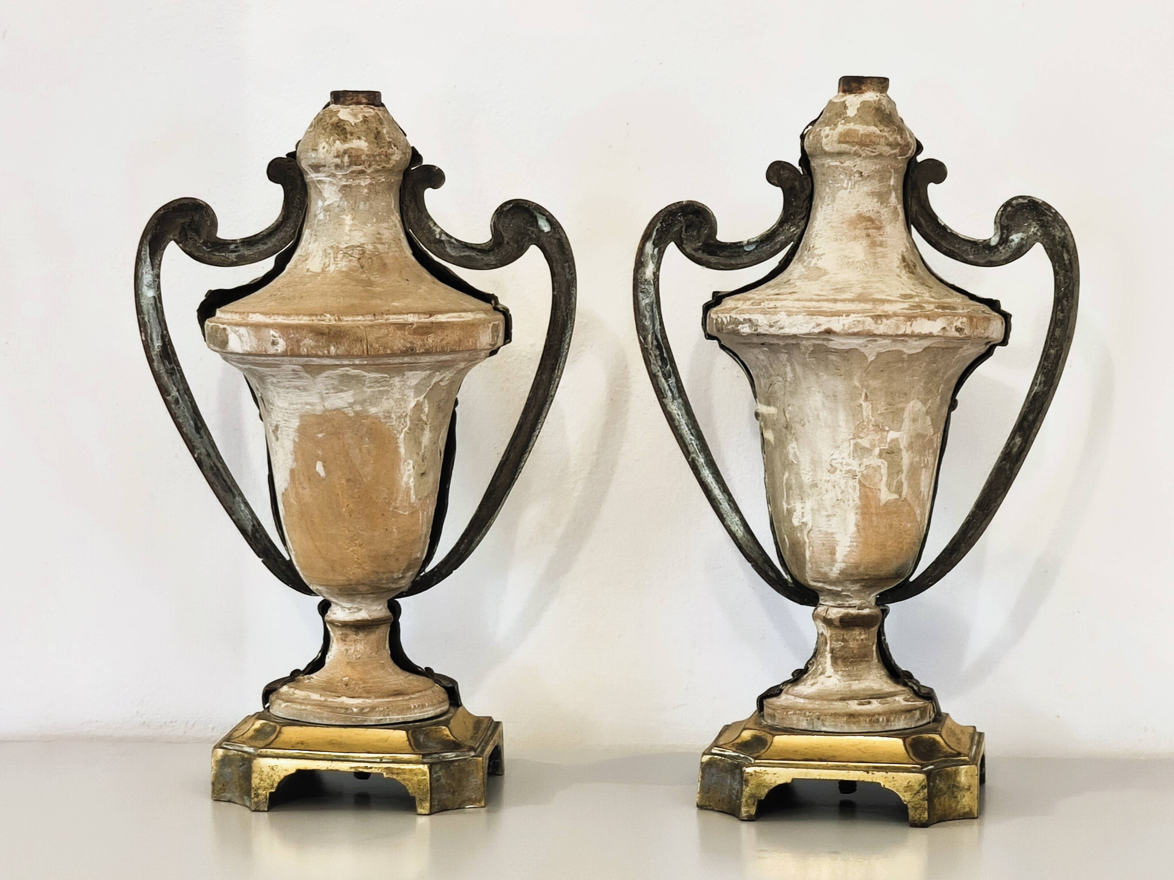 Pair of solid wood and bronze door handles, classical style, Italy 20th century.