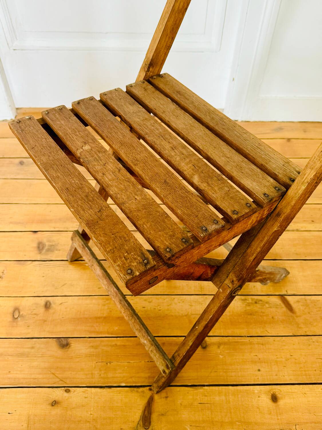 Two vintage wooden folding chairs, circa 1960
