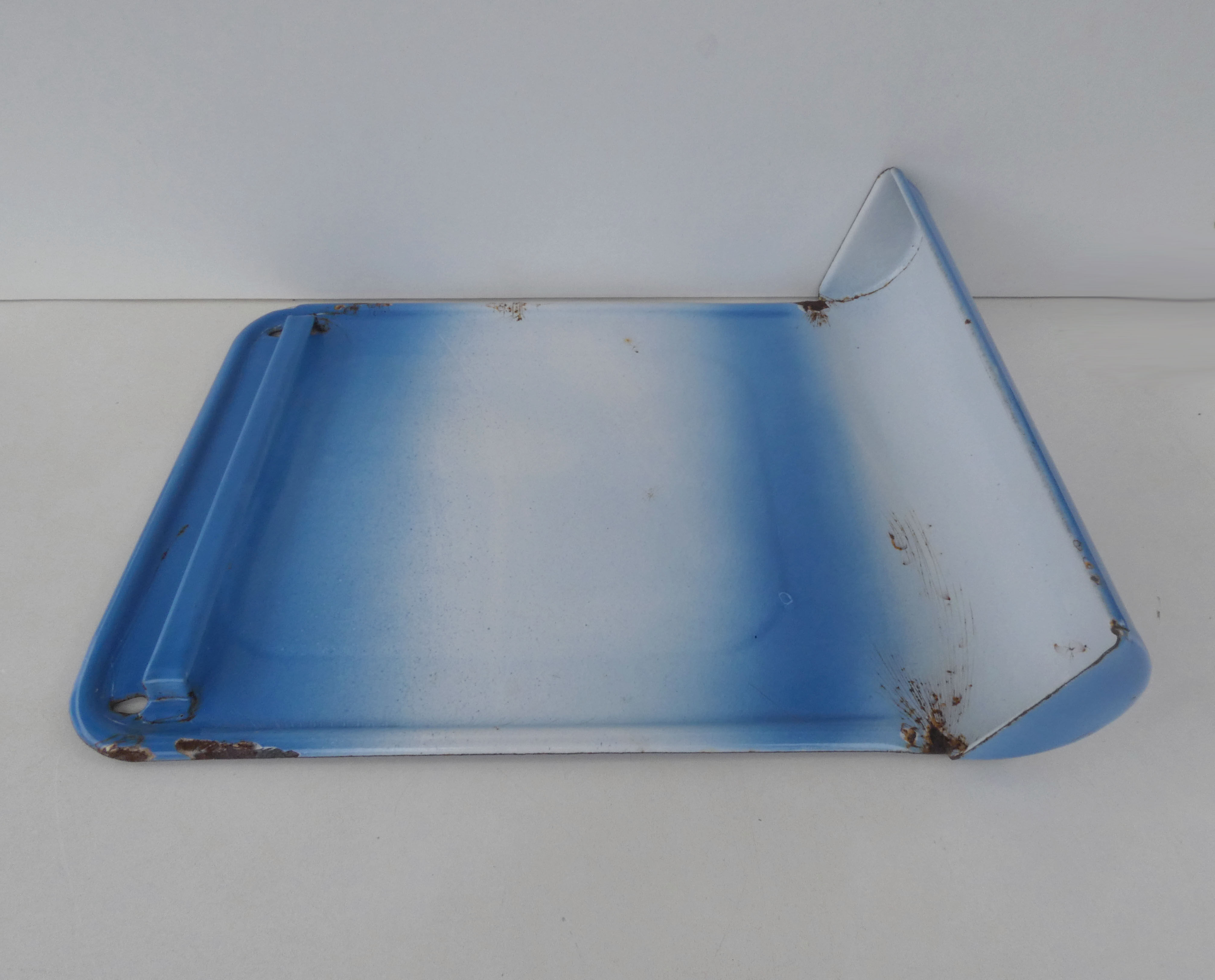 old blue enamelled steel utensil drainer