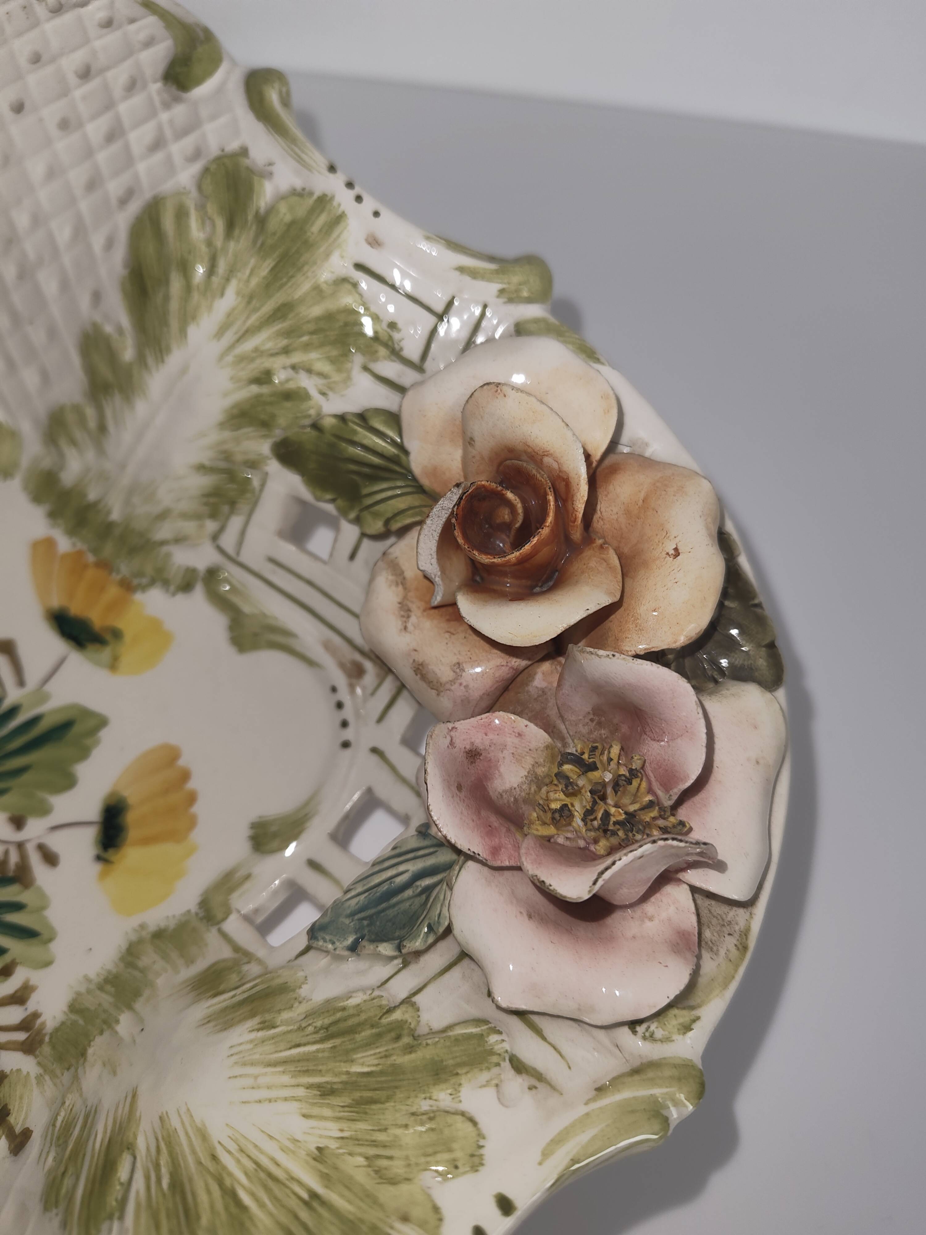 Openwork ceramic bowl with raised flower decoration in Italian style.